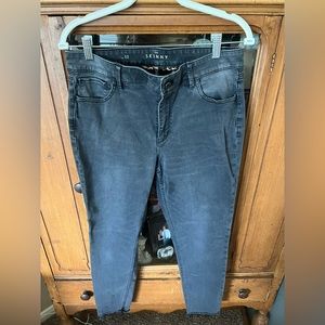 WHBM faded black skinny jeans ankle length.